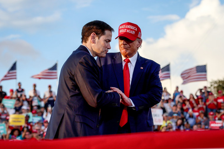 Former President Donald Trump stands with Sen. Marco Rubio, R-Fla., 