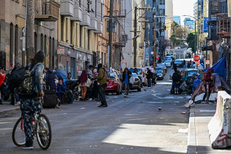 Homeless people line a street in San Francisco on Feb. 26, 2024.