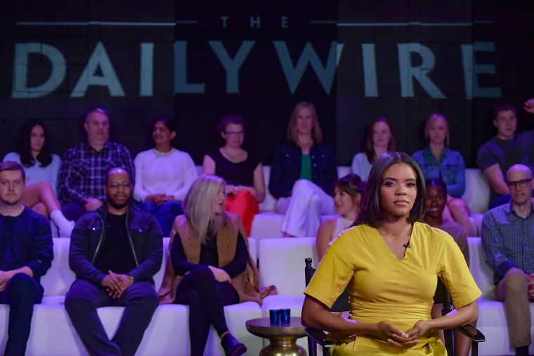 Audience members sit behind Candace Owens on the set of the show.