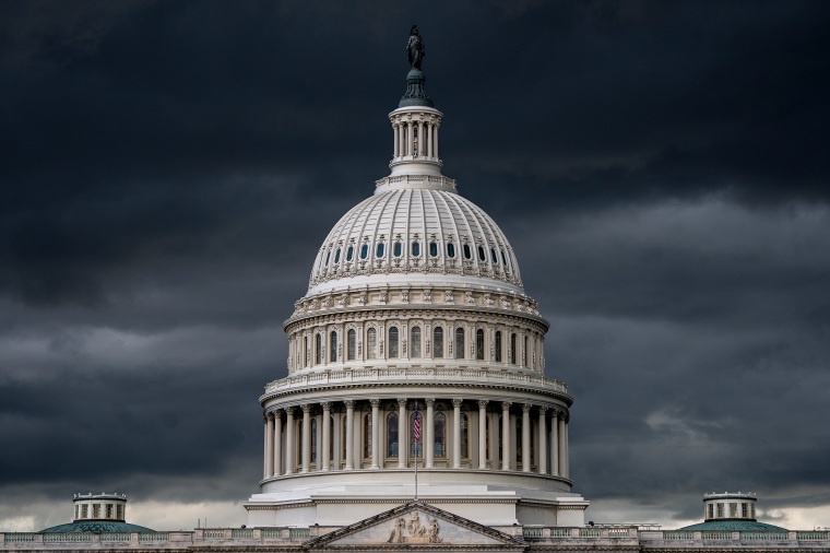 Storm clouds darken the skies above the Capitol