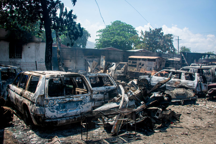 The charred remains of vehicles 