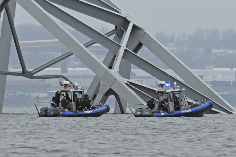 Police recovery crews work near the collapsed Francis Scott Key Bridge  on March 27, 2024. 