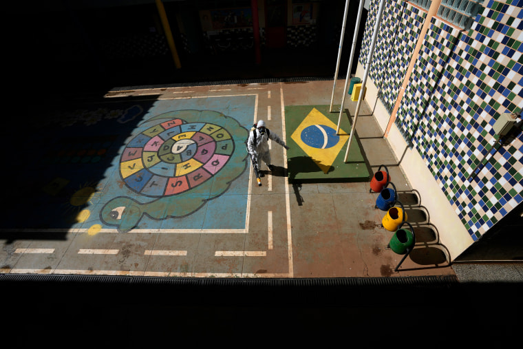 A worker fumigates a public school playground.