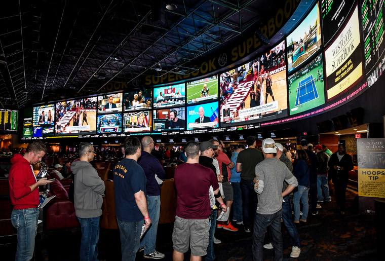 Guests line up to place bets at a viewing party for the NCAA Men's College Basketball Tournament on March 15, 2018 in Las Vegas.