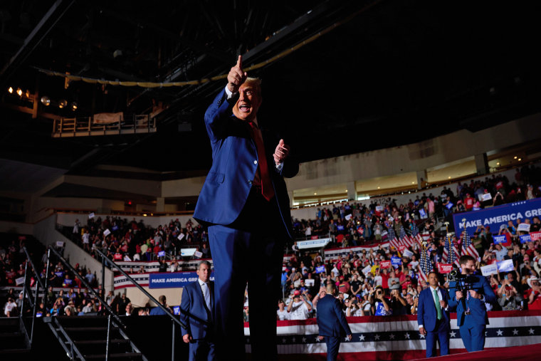 Former President Donald J. Trump gestures to supporters at a rally in Erie, Pa., on July 29, 2023. 