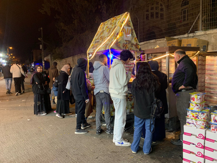 People buy snacks just outside the Damascus Gate on Friday night.