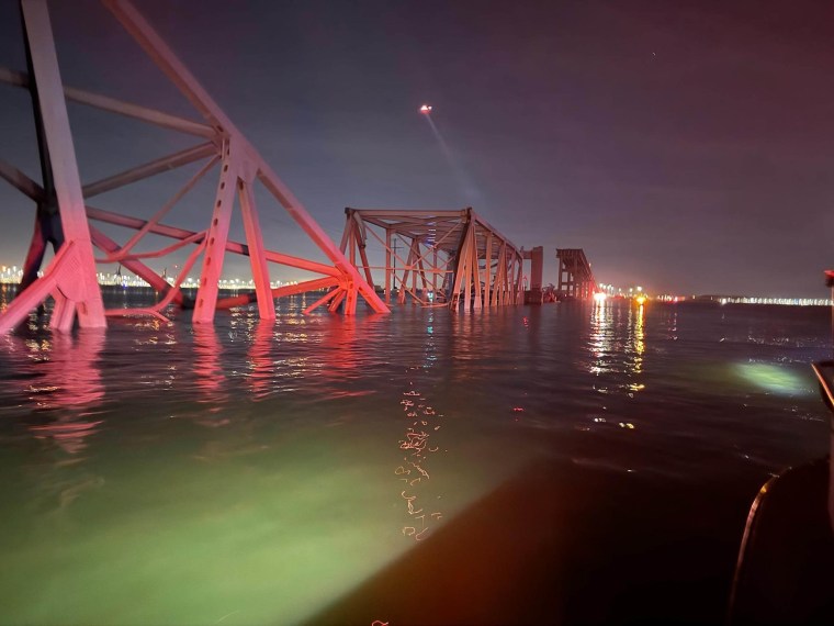 The Francis Scott Key Bridge lies in the water, following an impact from a cargo ship.