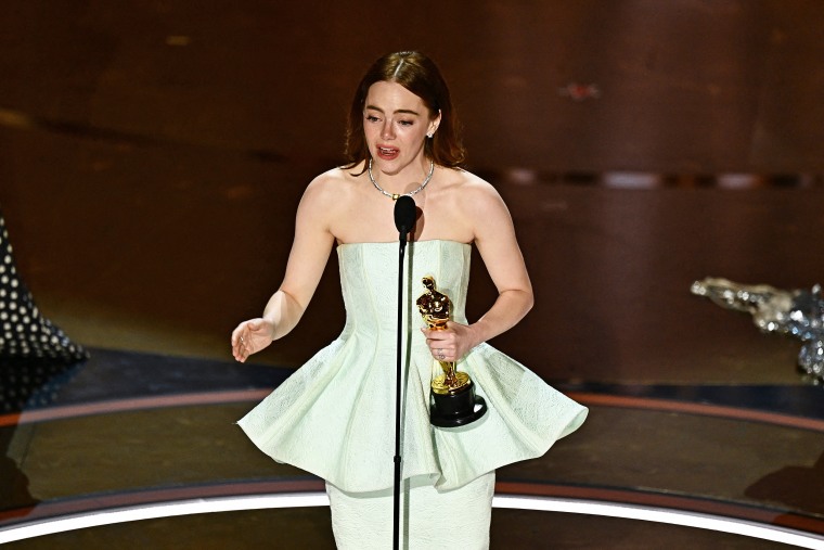 Emma Stone Accepts Best Actress Award At 2024 Oscars In 'Broken' Dress