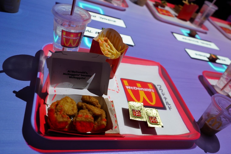 Chicken McNuggets, fries and WcDonald's Sauce on a red tray.