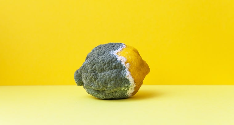Yellow Lemon Covered With Gray Mold