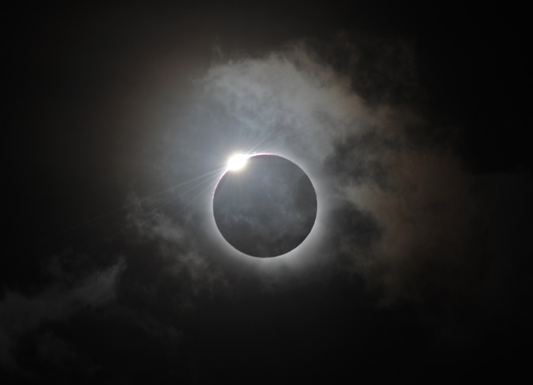 The "diamond ring effect" is shown following totality of the solar eclipse at Palm Cove in Australia's Tropical North Queensland in 2012.