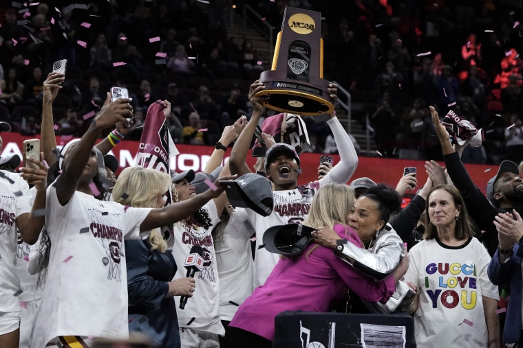 South Carolina players and coach celebrate with the trophy