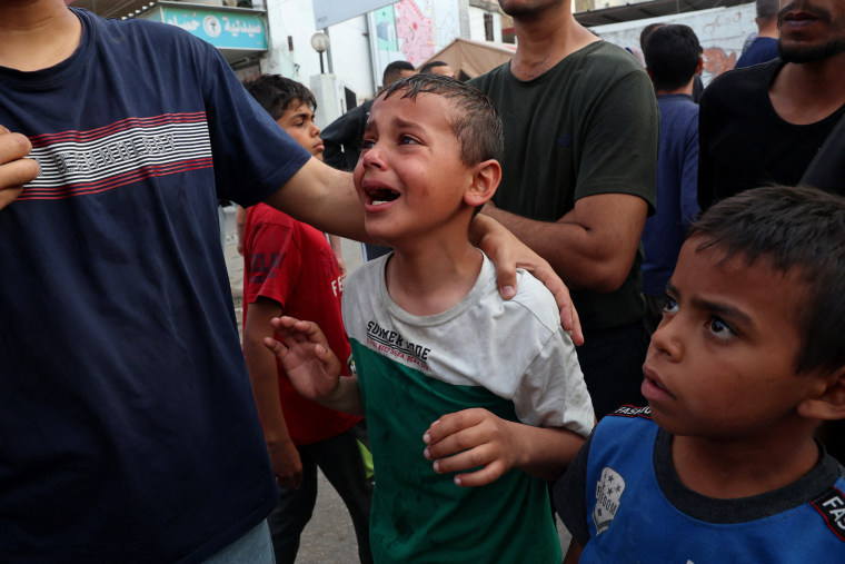 A Palestinian child cries as the victims of an Israeli bombardment are brought to the al-Najjar hospital in Rafah, southern Gaza Strip, on April 1, 2024.