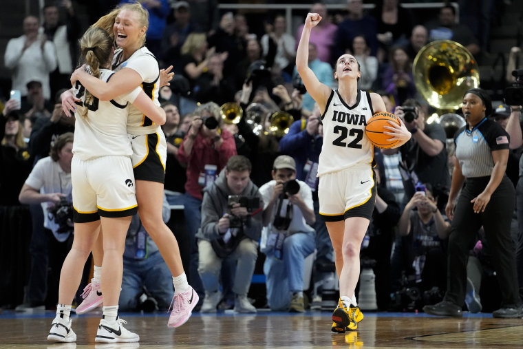 From left, Iowa's Kate Martin, Sydney Affolter and Caitlin Clark celebrate after defeating LSU Monday, April 1, 2024.