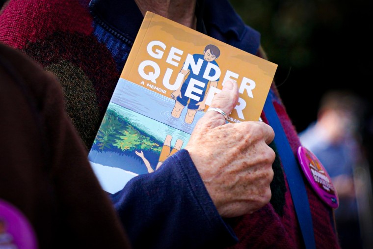 A person holds the Gender Queer memoir.