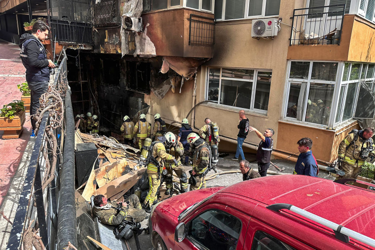 Firefighters work at the scene of a fire in a nightclub in Istanbul Tuesday, April 2, 2024.