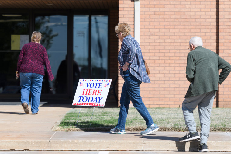 Voters walk into North Garland Church of Christ to cast their vote