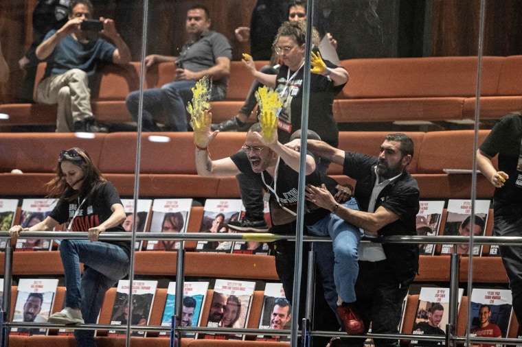 Families and supporters of hostages kidnapped during the deadly October 7 attack on Israel protest inside Israel's parliament in Jerusalem