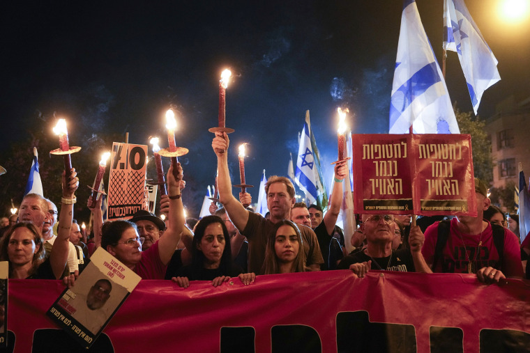 Marchers rally against Israeli Prime Minister Benjamin Netanyahu's government and call for the release of hostages in Jerusalem, Tuesday, April 2, 2024. 
