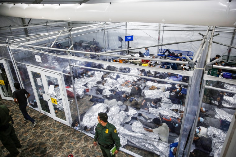 Minors lie inside a pod at the Donna Department of Homeland Security holding facility
