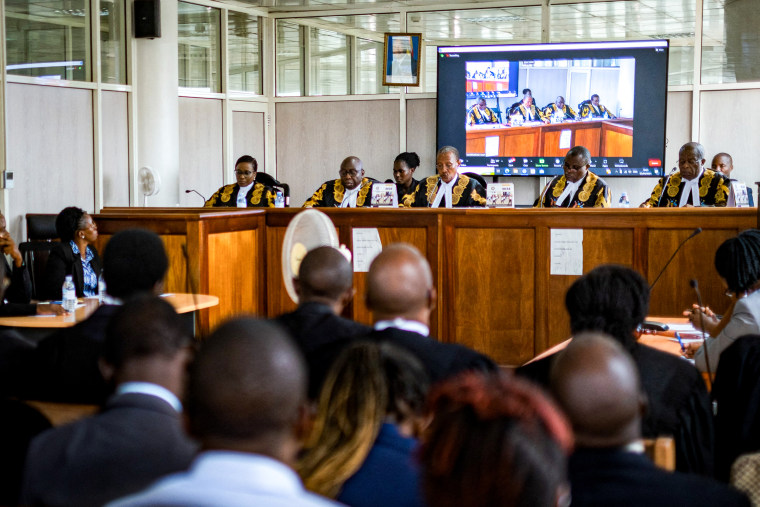 Uganda's deputy chief justice and head of the court Buteera, with other five judges, delivers a judgment on the consolidated petitions challenging the constitutionality of the Anti-Homosexuality Act.