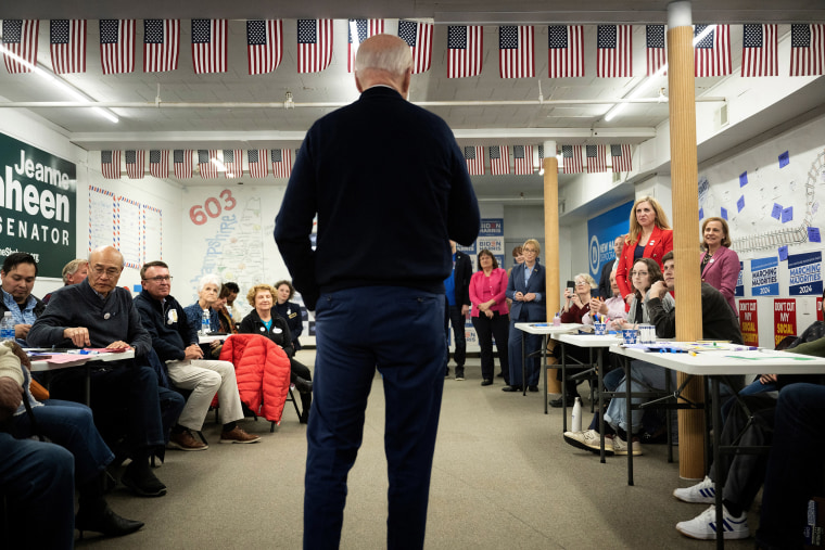 Attendees listen as President Biden speaks at the opening.