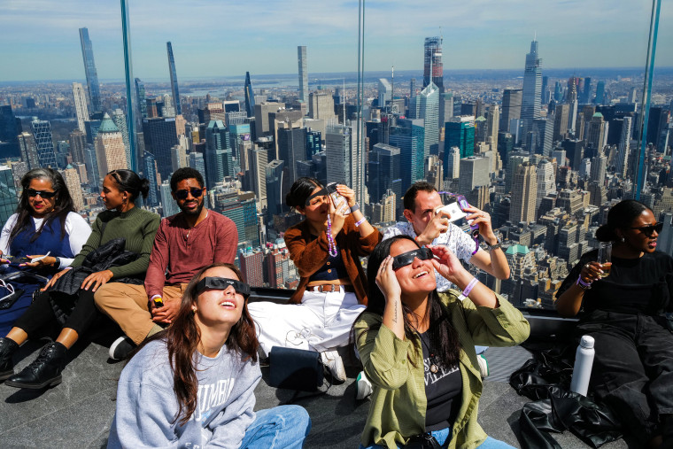 People look toward the sky at the 'Edge at Hudson Yards' observation deck 