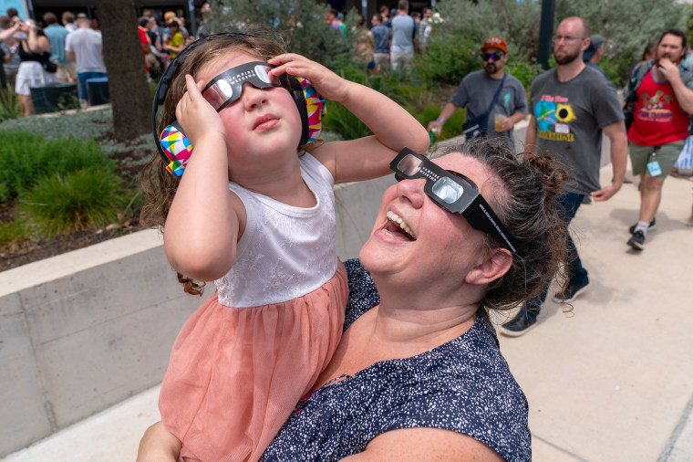 science family mother daughter eclipse glasses