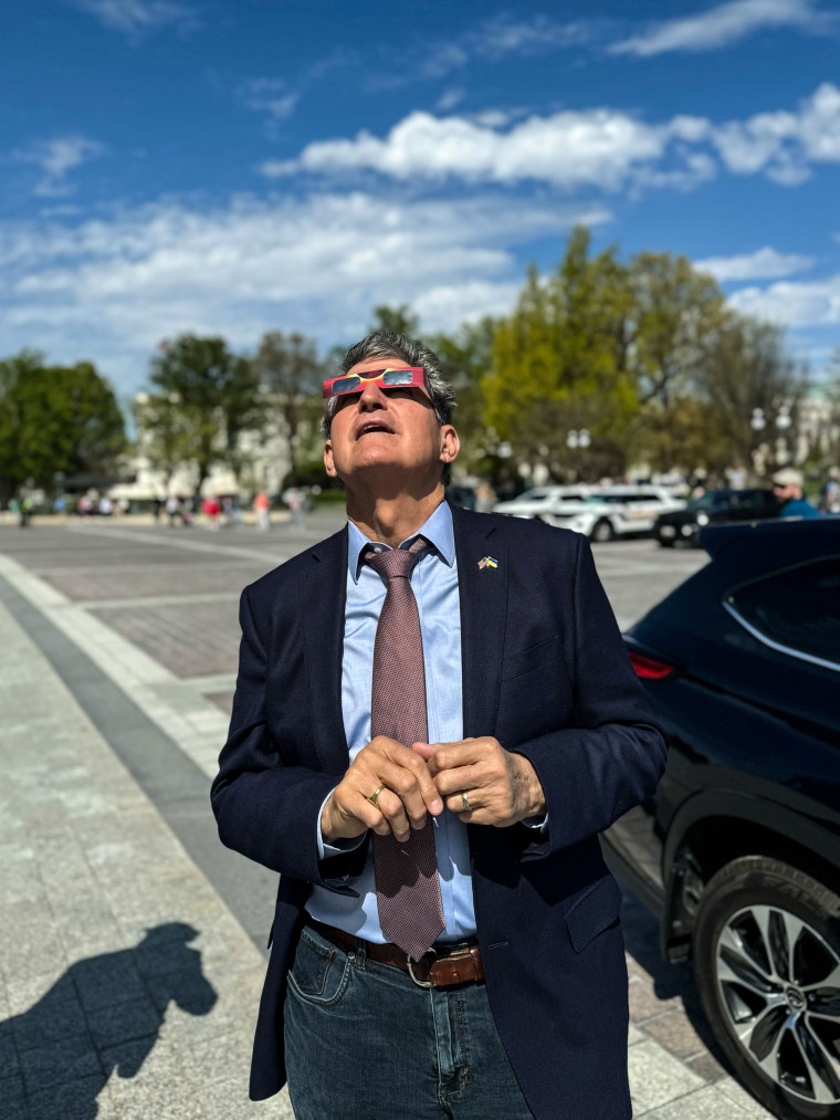 Sen, Joe Manchin, D-W.Va., takes in the eclipse at the U.S. Capitol on April 8, 2024.