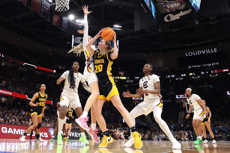 Kate Martin of the Iowa Hawkeyes looks to shoot around Chloe Kitts of the South Carolina Gamecocks on April 7, 2024 in Cleveland.