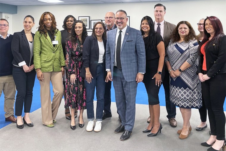 group photo smiling happy education secretary teachers