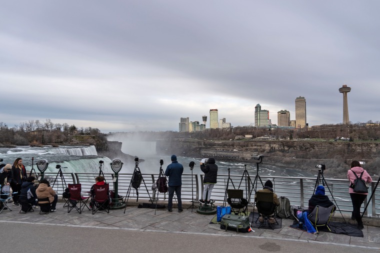 Photographers take their positions early in the morning in preparation for the solar eclipse later today on April 8, 2024 in Niagara Falls, New York.