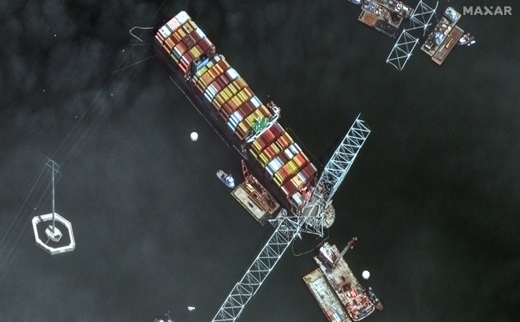 This handout satellite image taken and released by Maxar Technologies on April 8, 2024 shows a close-up of the Dali container ship and the Francis Scott Key Bridge.