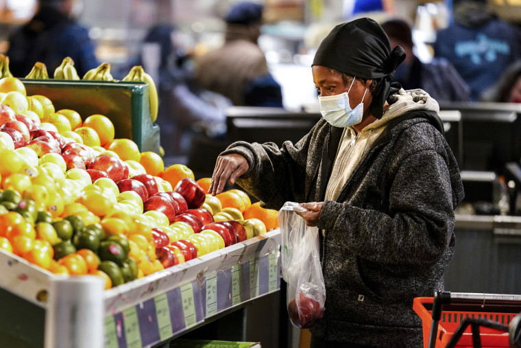 A shopper buys fruit at the Reading Terminal Market in Philadelphia