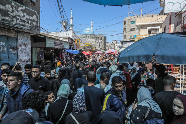 Palestinians shop for Eid al-Fitr, the end of the fasting month of Ramadan, in Rafah, Gaza on April 9, 2024.