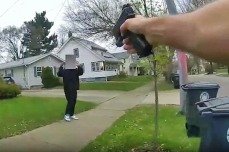 A police officer point his gun at a 15-year-old holding a fake gun on April 1, 2024, in Akron, Ohio.
