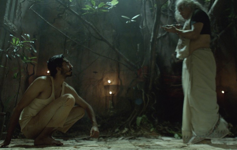 Dev Patel as "Kid" and Vipin Sharma as "Alpha" in a scene from "Monkey Man."