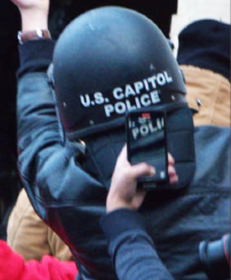 Richard Zachary Ackerman wearing the U.S. Capitol Police helmet.