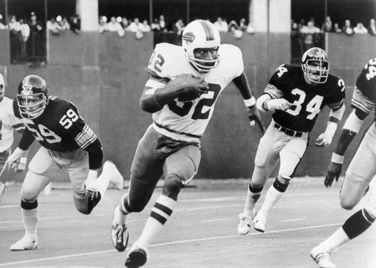 O.J. Simpson of the Buffalo Bills breaks away from Steeler tacklers in 1975.