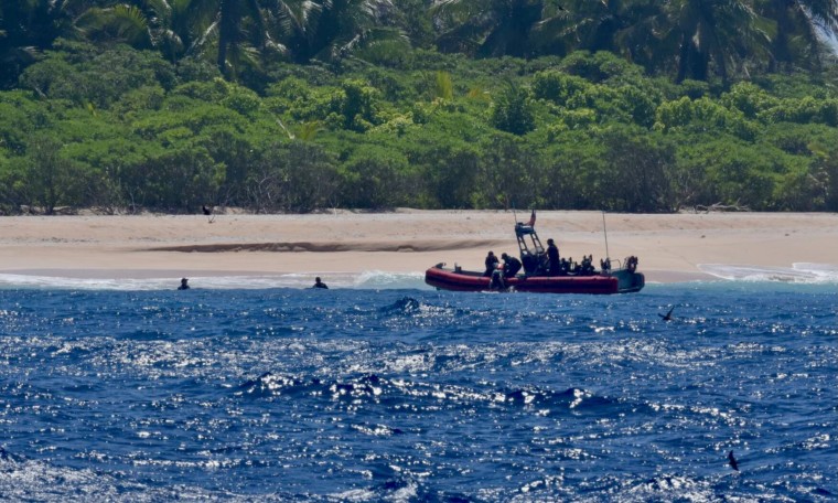 The crew of USCGC Oliver Henry rescues three mariners stranded on Pikelot Atoll, Yap State, Federated States of Micronesia