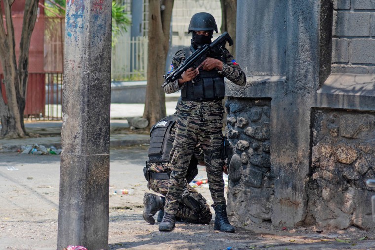 Haitian police stand guard on a street corner amid gang violence in Port-au-Prince on April 8,2024. 