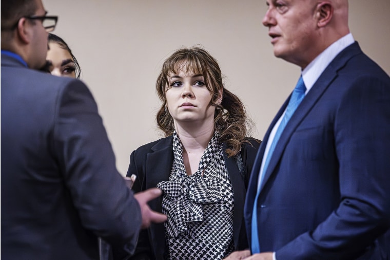 "Rust" armorer Hannah Gutierrez-Reed, center, talks with her attorney Jason Bowles, right, and her defense team at her involuntary manslaughter trial in Santa Fe, N.M., on March 5.