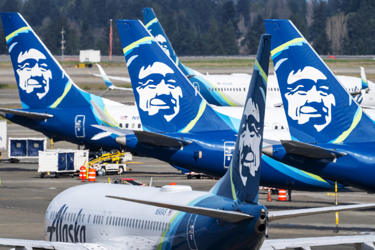 Alaska Airlines Boeing 737 airliners sit on the tarmac