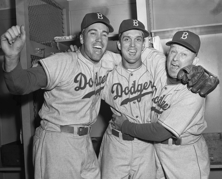 Then-Dodgers manager Charley Dressen, right, hugs Carl Erskine and Duke Snider