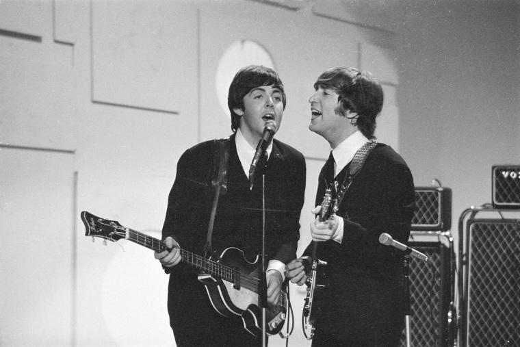 Paul McCartney, left, and John Lennon on the Ed Sullivan Show