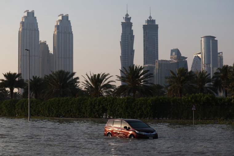 An abandoned vehicle on a flooded highway after a rainstorm in Dubai, United Arab Emirates, on Wednesday, April 17, 2024.
