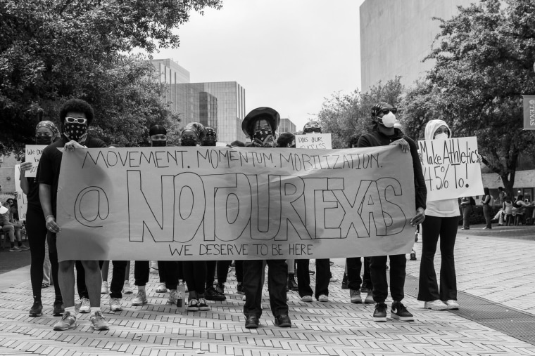 Students protest the layoffs of employees in DEI-related positions at the University of Texas at Austin on Monday, April 15, 2024.