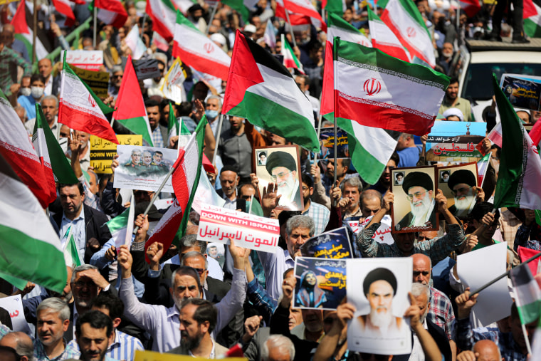 Iranians march.
