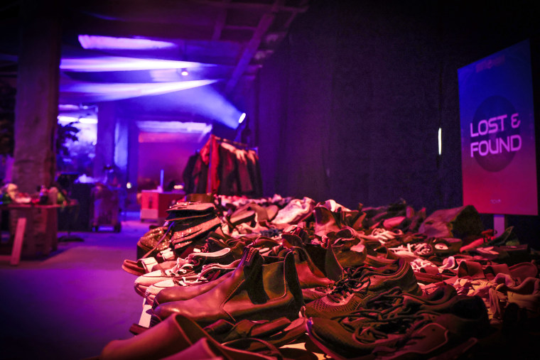 Shoes on display in the "Lost & Found" area of the exhibit.