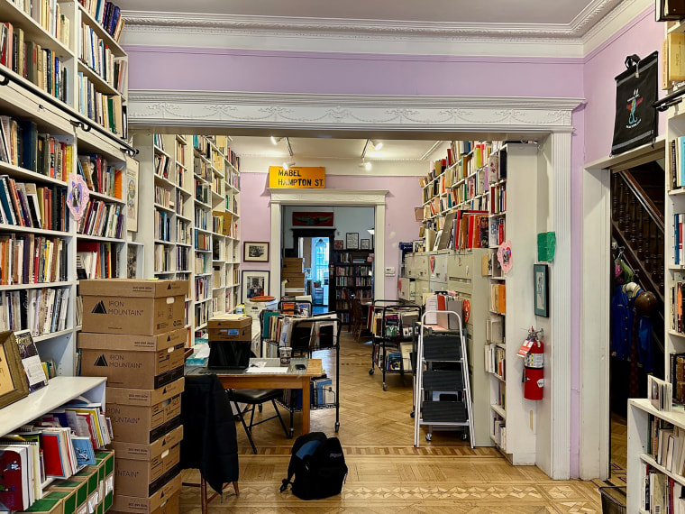 Books line the walls of the Lesbian Herstory Archives' first floor. 
